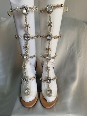 New without Tags Embellished Gladiator Crystal Knee-High Sandals - Clear/Gold